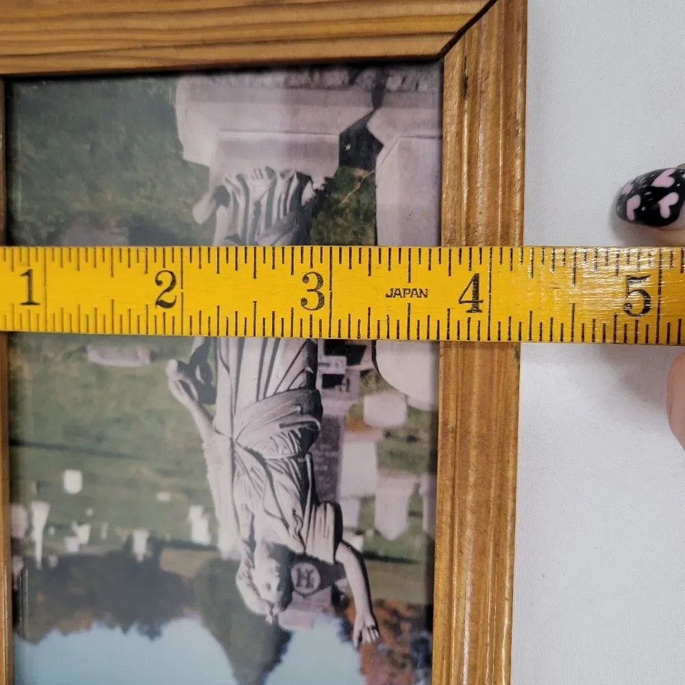 Wooden Frame with Statue Photograph